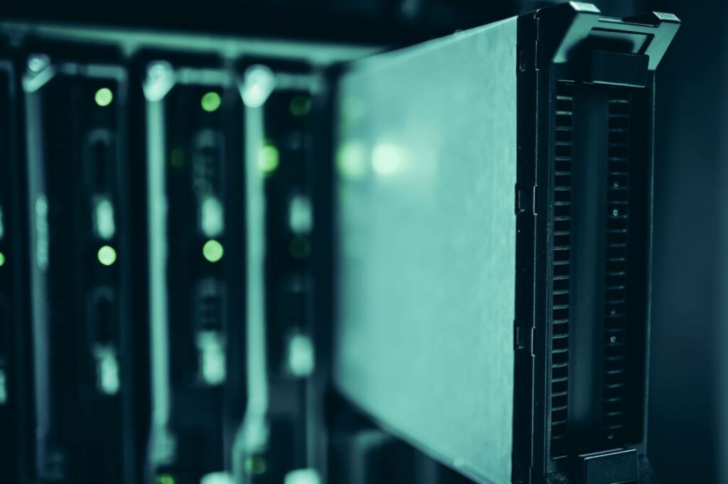 Close-up of server racks with glowing indicator lights
